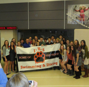Members of last years swim team pose for a picture at the end of the year banquet