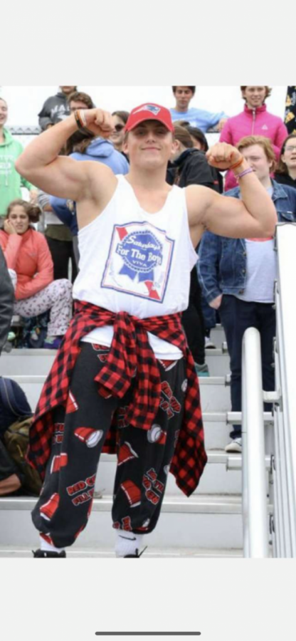 Flexi shows his brawny arms to the camera during this years spirit week.